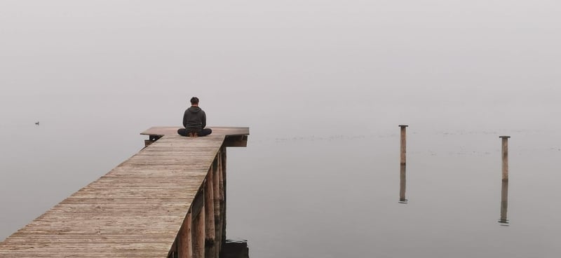 Person practicing yoga in a peaceful setting